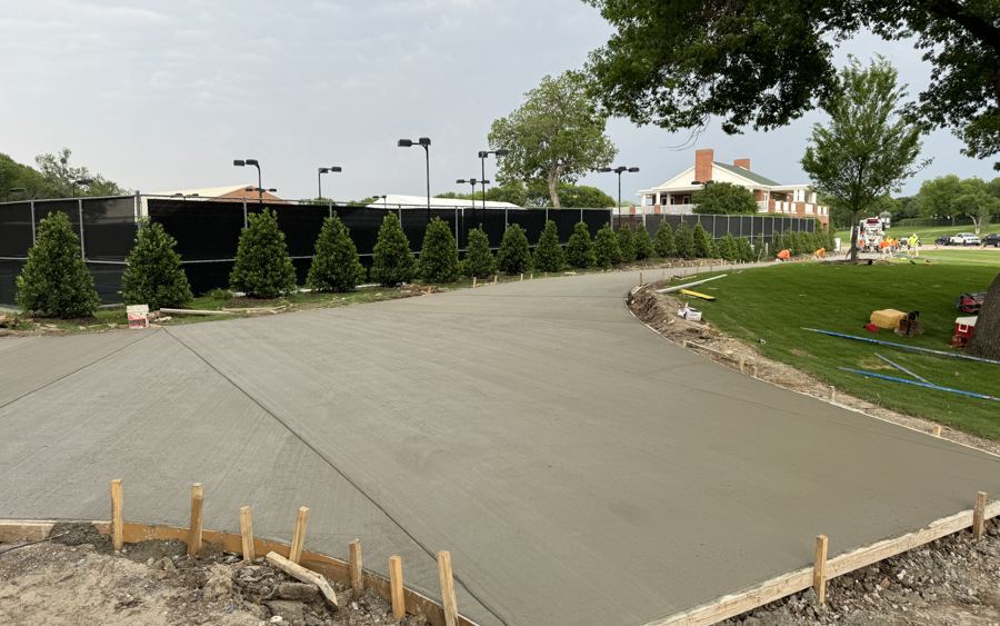 Freshly poured curved concrete drive