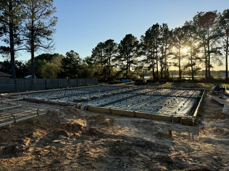 Residential foundation formed with rebar at sunset