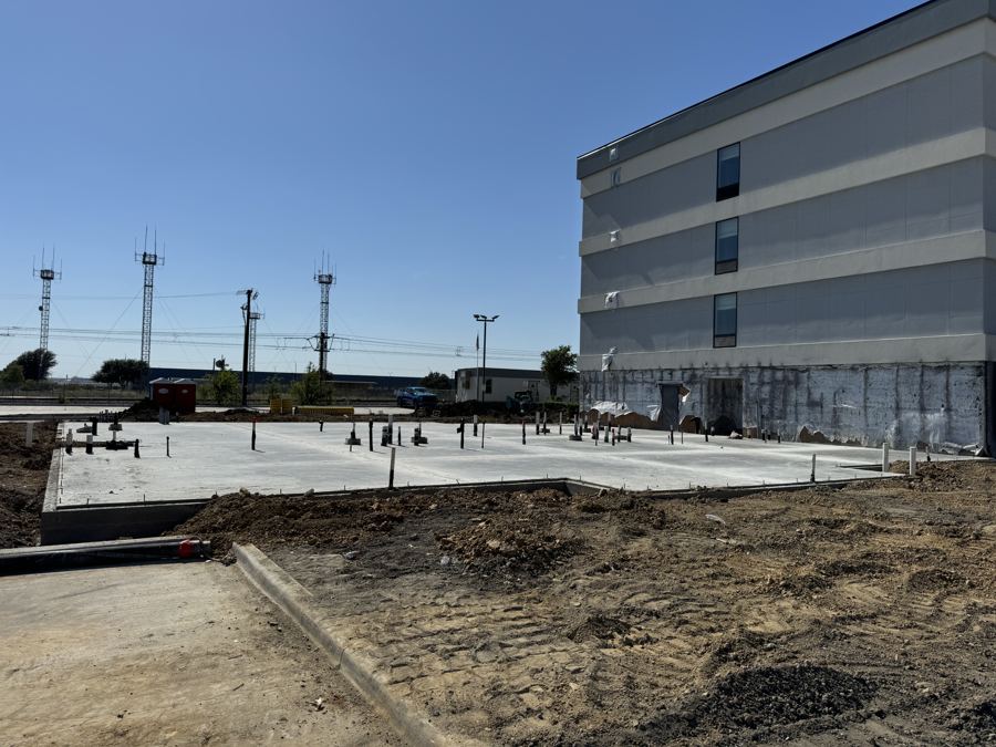 Large commercial foundation slab next to a hotel